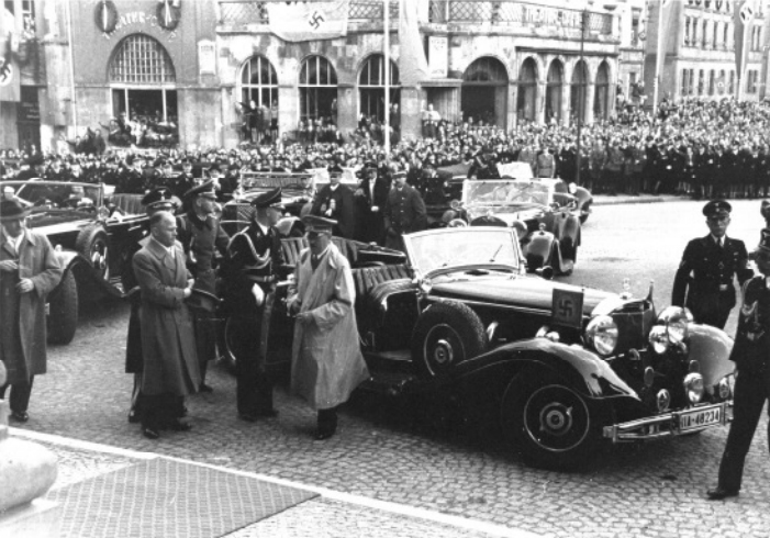 Adolf Hitler arrives at the Aubsburg theatre and is welcomed by Gauleiter Karl Wahl